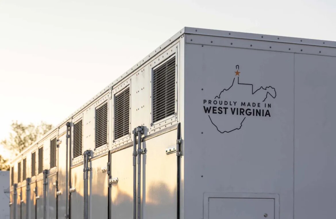 A grid-scale battery stands against a clear sky.
