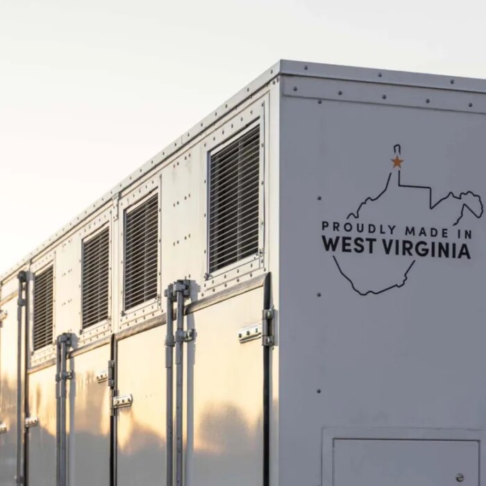 A grid-scale battery stands against a clear sky.