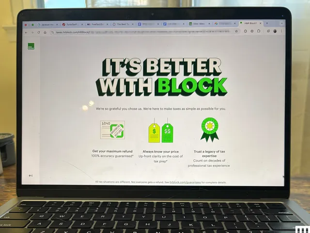 Closeup of an open laptop with the screen showing H&R Block tax filing software