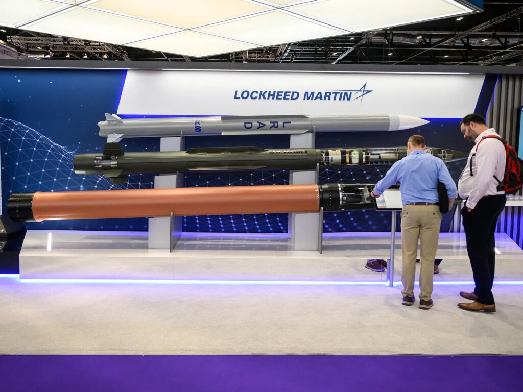 Image may contain Airport Adult Person Furniture and Table