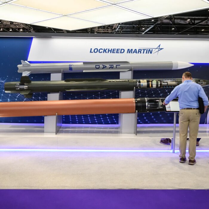 Image may contain Airport Adult Person Furniture and Table