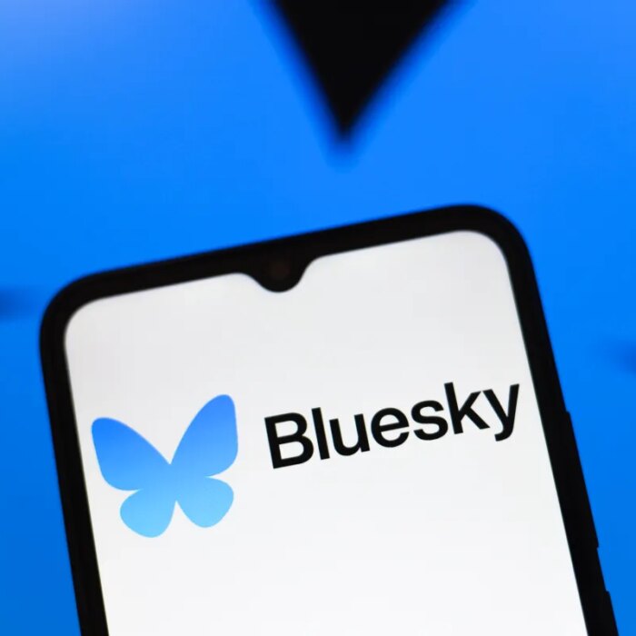 Bluesky logo appears on the screen of a smartphone
