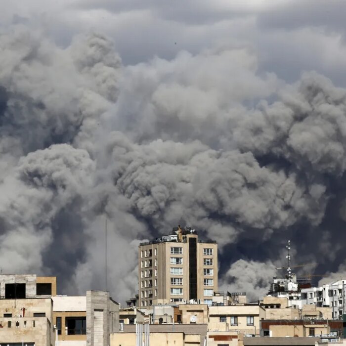 Smoke rises from the area after it was targeted in attacks as a series of explosions are heard in Tehran, Iran on March 01, 2026. The Islamic Republic of Iran Broadcasting (IRIB) building after Iranian authorities said it was targeted in the attacks.