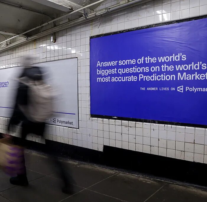 A Polymarket advertisement in a subway station in New York, US, on Thursday, Feb. 5, 2026. Kalshi and Polymarket, which have been assailed by critics for encouraging financial risk taking by making betting more accessible, are now using the promise of free groceries to win over New Yorkers.