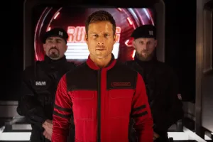 THE RUNNING MAN, David Zayas (left), Glen Powell (front), 2025. ph: Ross Feguson /© Paramount Pictures /Courtesy Everett Collection