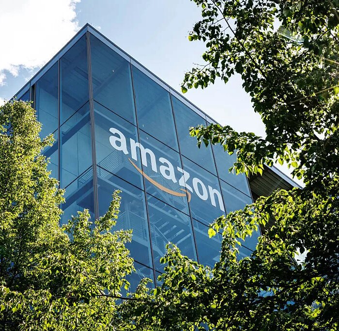 The logo and lettering of global online mail order company Amazon can be seen on the façade of Amazon Germany