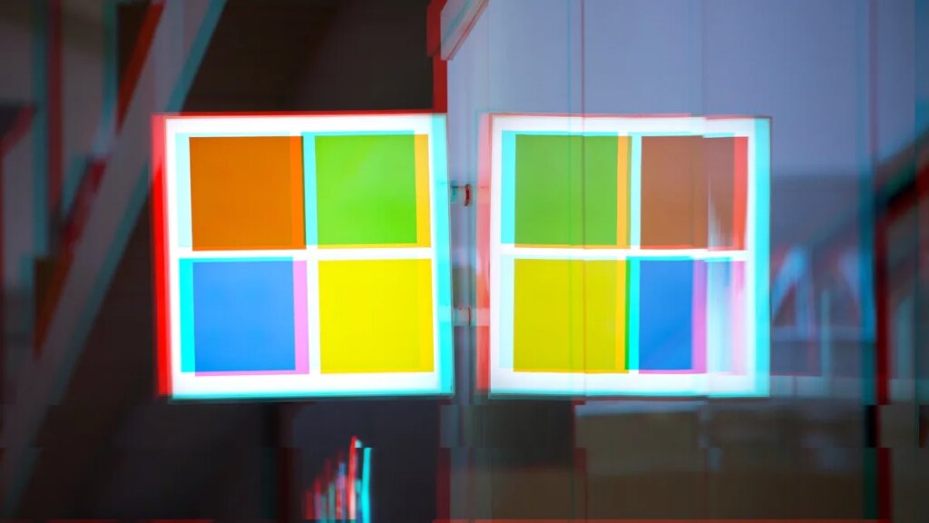 A moshed/glitchy version of a Windows logo on a Microsoft Store front.
