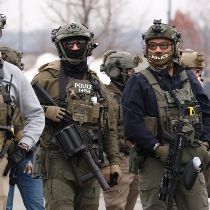 US Homeland Security Investigations (HSI) agents stand guard at the Bishop Henry Whipple Federal Building in Minneapolis, Minnesota, on January 8, 2026.