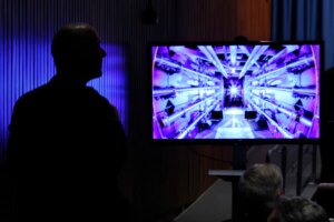 Guests await the beginning of a news conference with U.S. Energy Secretary Jennifer Granholm at the Department of Energy headquarters to announce a breakthrough in fusion research on December 13, 2022 in Washington, DC.