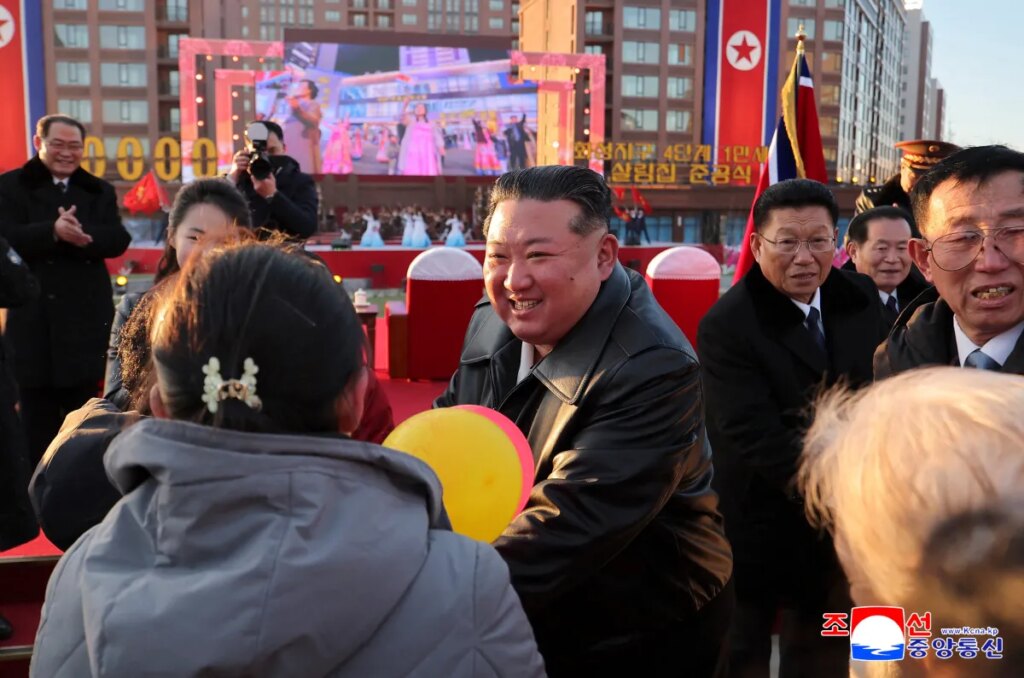 North Korean leader Kim Jong Un congratulating residents moving into their new homes at the inauguration ceremony of 10,000 flats at fourth stage in Hwasong area of Pyongyang.