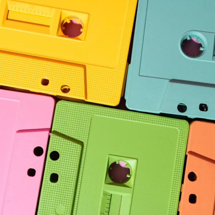 Vibrant cassette tapes in yellow, pink, green, blue, and orange