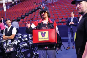 CHICAGO, ILLINOIS - AUGUST 18: Comedian Stephen Colbert carries a container of hot dogs ahead of the Democratic National Convention (DNC) at the United Center  on August 18, 2024 in Chicago, Illinois.  The United Center will host the DNC, which is officially scheduled to kick off on Monday, August 19 and run through Thursday, August 22. (Photo by Kevin Dietsch/Getty Images)