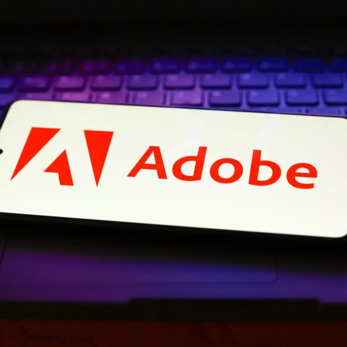 The Adobe Inc. logo displayed on a smartphone screen.
