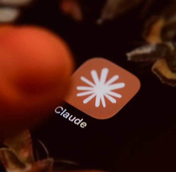 The Claude app icon is displayed on a smartphone screen