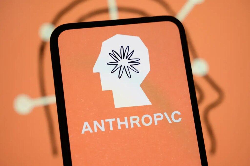 The Anthropic logo is displayed on the screen of a smartphone with the company