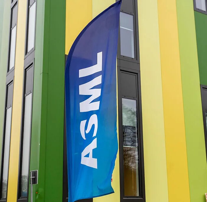 A banner flag with the ASML logo outside the Brainport Industries Campus, which houses the ASML Academy, in Eindhoven, Netherlands.