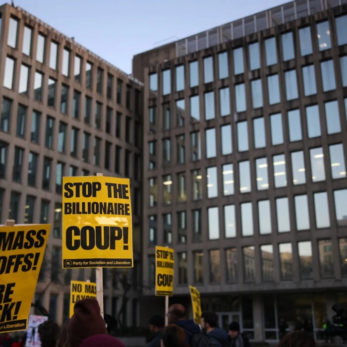 Demonstrators gather outside of the Office of Personnel Management in Washington, D.C. on February 7, 2025 to protest federal layoffs and demand the termination of Elon Musk from the Department of Government Efficiency (DOGE). (Photo by Bryan Dozier / Middle East Images / Middle East Images via AFP)