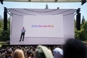 Photo from 2024 WWDC keynote featuring a tagline that reads “AI for the rest of us”