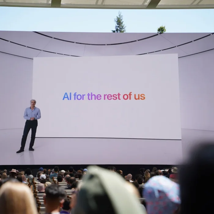 Photo from 2024 WWDC keynote featuring a tagline that reads “AI for the rest of us”