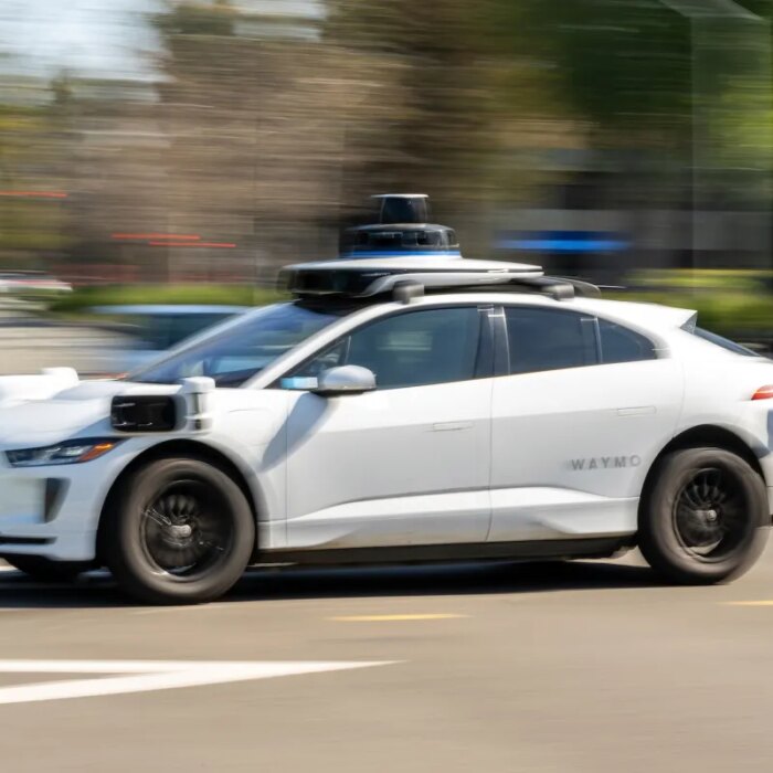 A Waymo autonomous taxi outside the Google headquarters