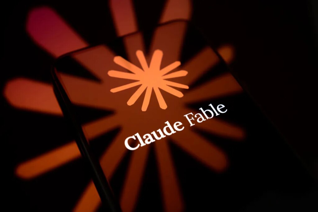 The Claude Fable logo is displayed on the screen of a smartphone placed on a reflective surface onto which the company