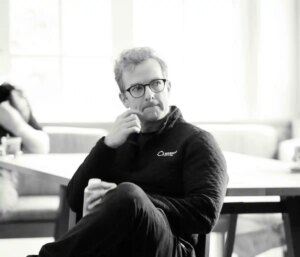 Mike Schroepfer sits in a chair.