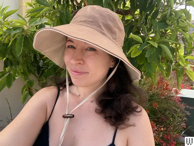 Image may contain: Clothing, Hat, Sun Hat, Adult, and Person