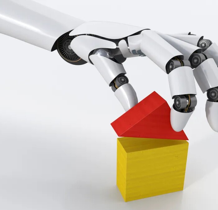 Robot hand building house with building blocks