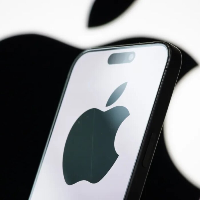 In this photo illustration, the logo of Apple Inc. is displayed on a smartphone screen, with the company